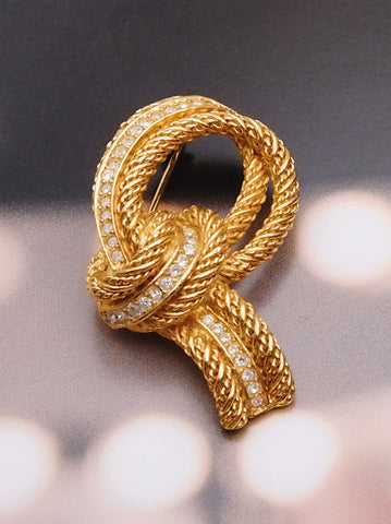 Pre-owned vintage Christian Dior textured knot brooch | on slowness