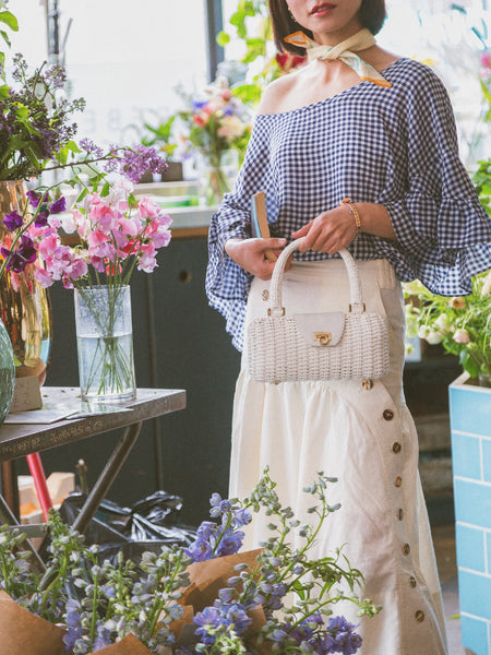 vintage Salvadore Ferragamo white lock wicker hand bag | ON SLOWNESS