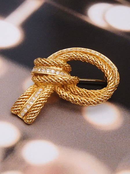 Pre-owned vintage Christian Dior textured knot brooch | on slowness