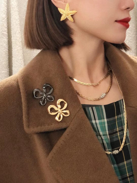 YSL Yves Saint Laurent black raffia bow brooch (Vintage)