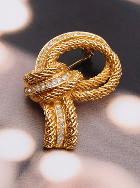 Pre-owned vintage Christian Dior textured knot brooch | on slowness